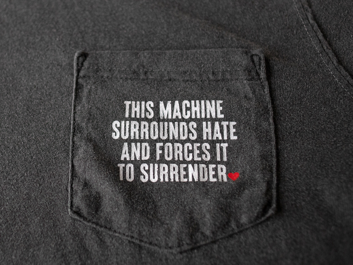 Surrounds Hate Pocket Tee